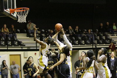 Image: Both Kortnei Johnson(3) and Cory Chance(40) go after a rebound.