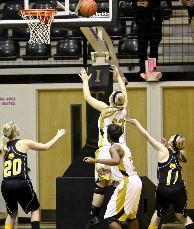 Image: Jaclynn Lewis(13) takes command of the lane late in the game to keep Itasca at bay.