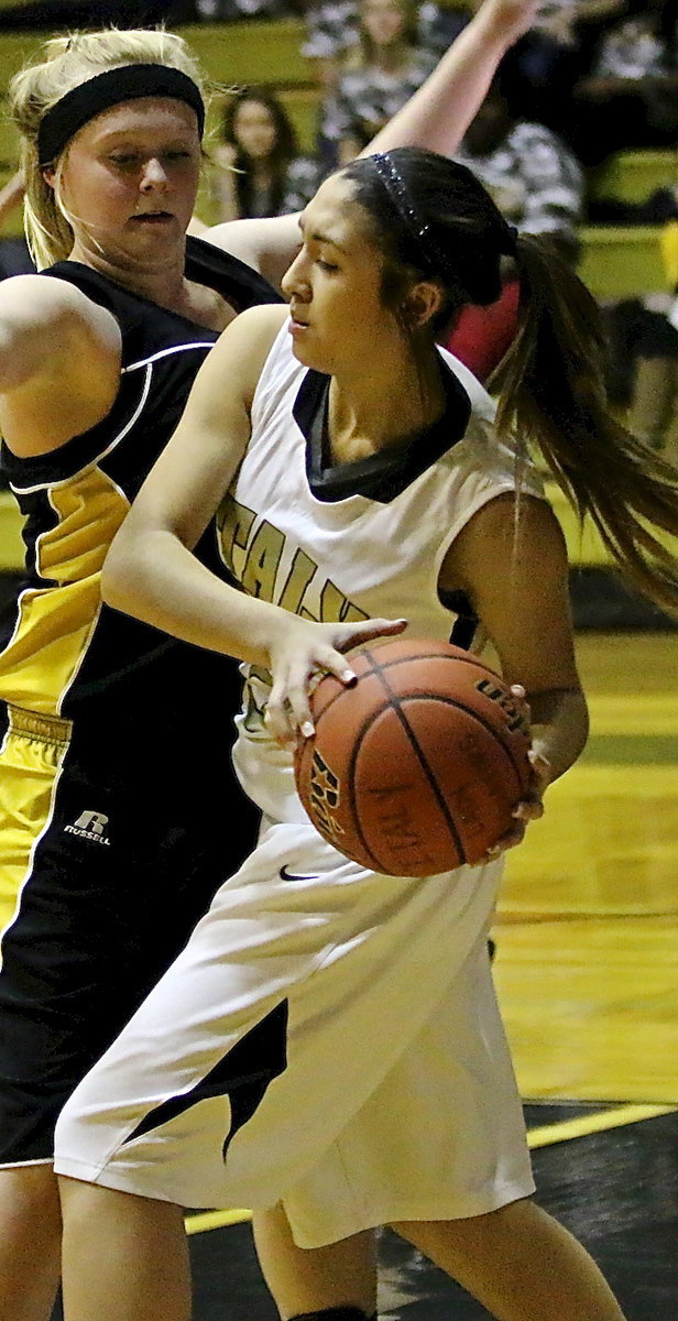 Image: Lizzie Garcia(25) protects the ball while being pressured by Itasca.