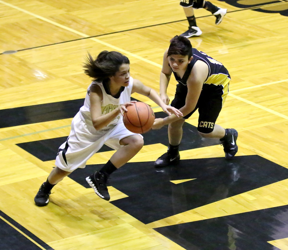 Image: Alex Minton(12) tries to generate some points. Minton finished the game with 6-points.