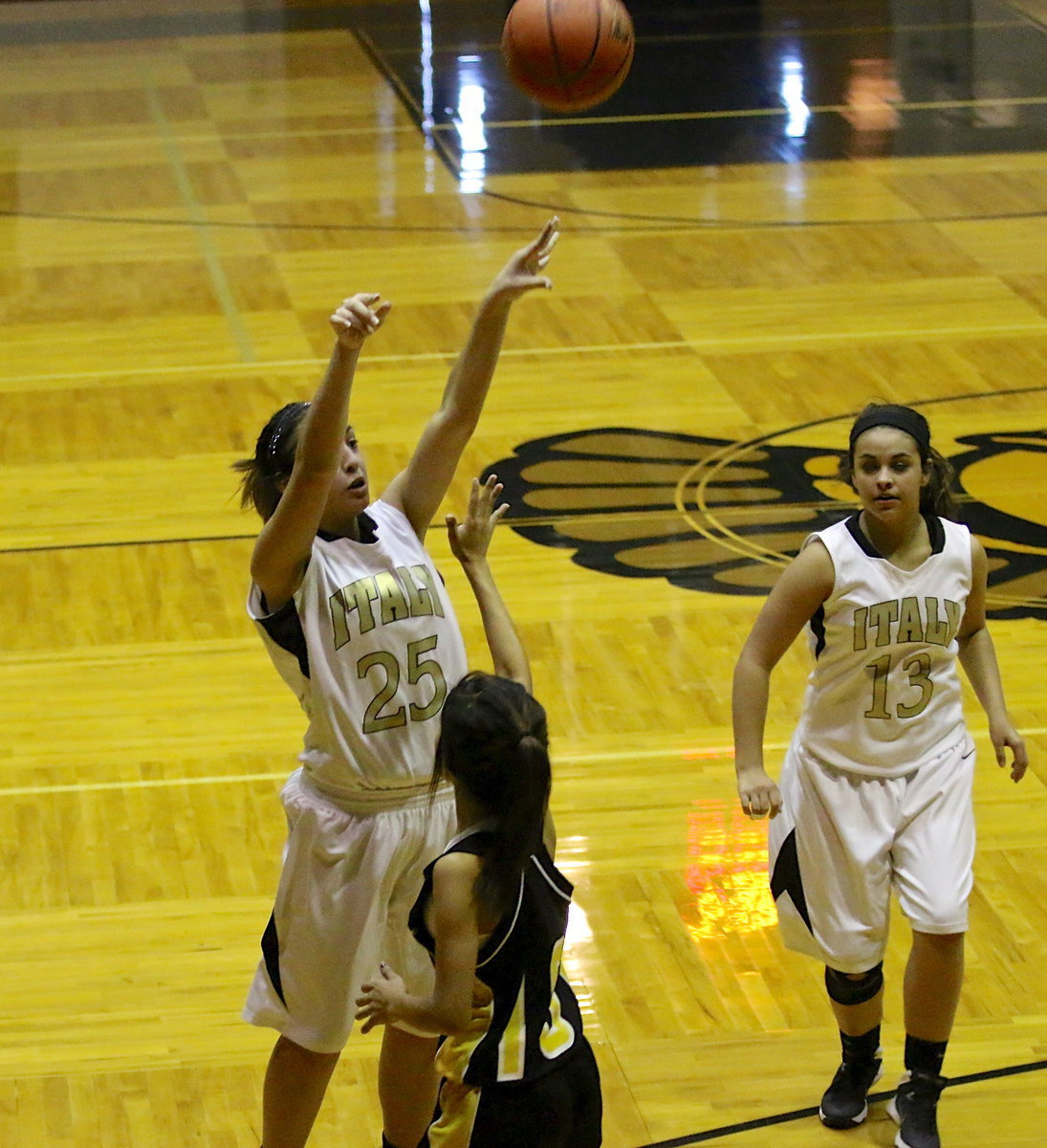 Image: Lizzie Garcia(15) rises and let’s her shot fly over an Itasca defender.