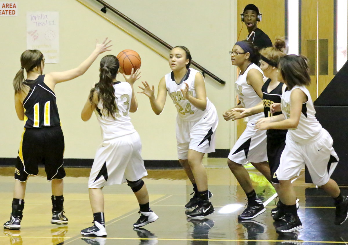 Image: Vanessa Cantu(24) rebounds and then passes to teammate Ashlyn Jacinto(13) as Italy’s JV Ladies transition from defense to offense.