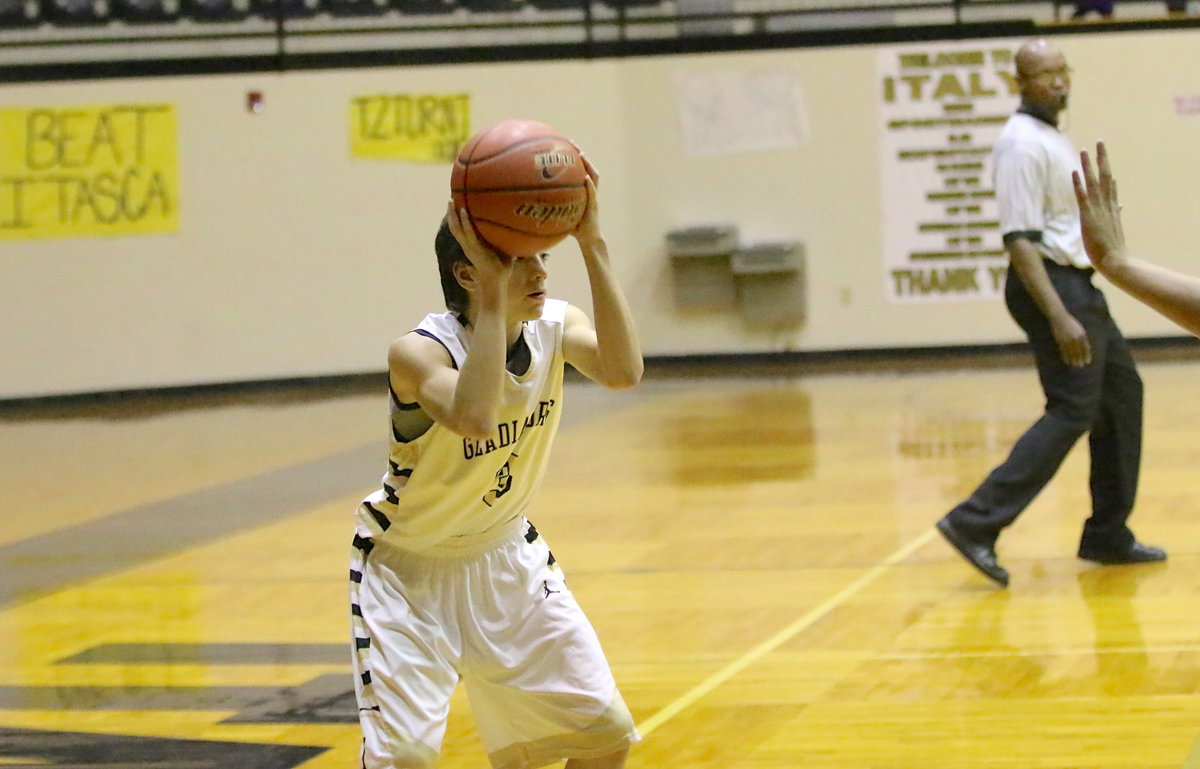 Image: Dylan McCasland(3) uses the pump fake to lure a Wampus Cat defender away from the paint.