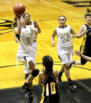 Image: Halee Turner(5) continues to attack the basket.