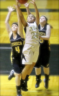 Image: Vanessa Cantu(24) out leaps two Itasca players for the rebound.