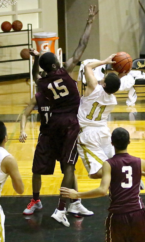Image: Senior guard, Tyler Anderson(11) craftily scores a bucket for the Gladiators.