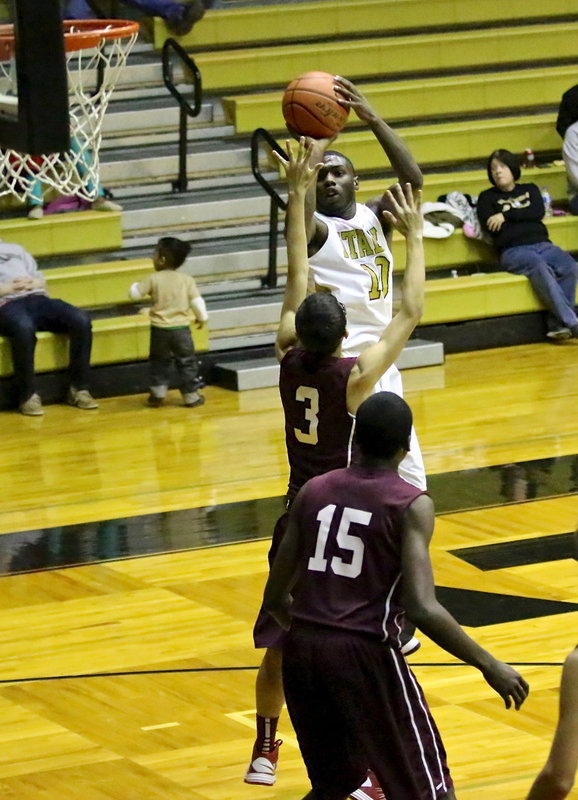 Image: Senior Gladiator, TaMarcus Sheppard(10) scores 2 of his 10-points against Summit.