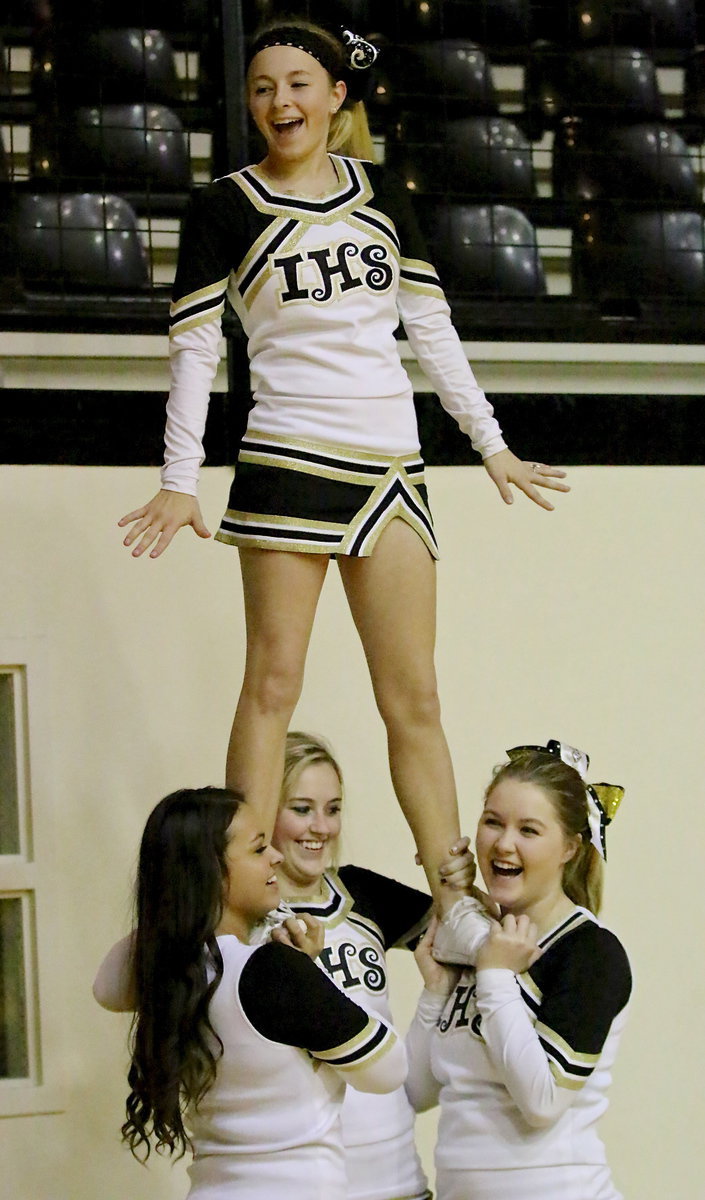 Image: Varsity cheerleaders Ashlyn Jacinto, Kelsey Neslon, Taylor Turner and Britney Chambers help Italy reach the top of the Summit.