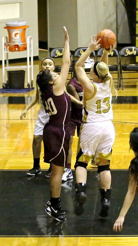 Image: A strong move into the lane gets 2-points for Jaclynn Lewis(13).