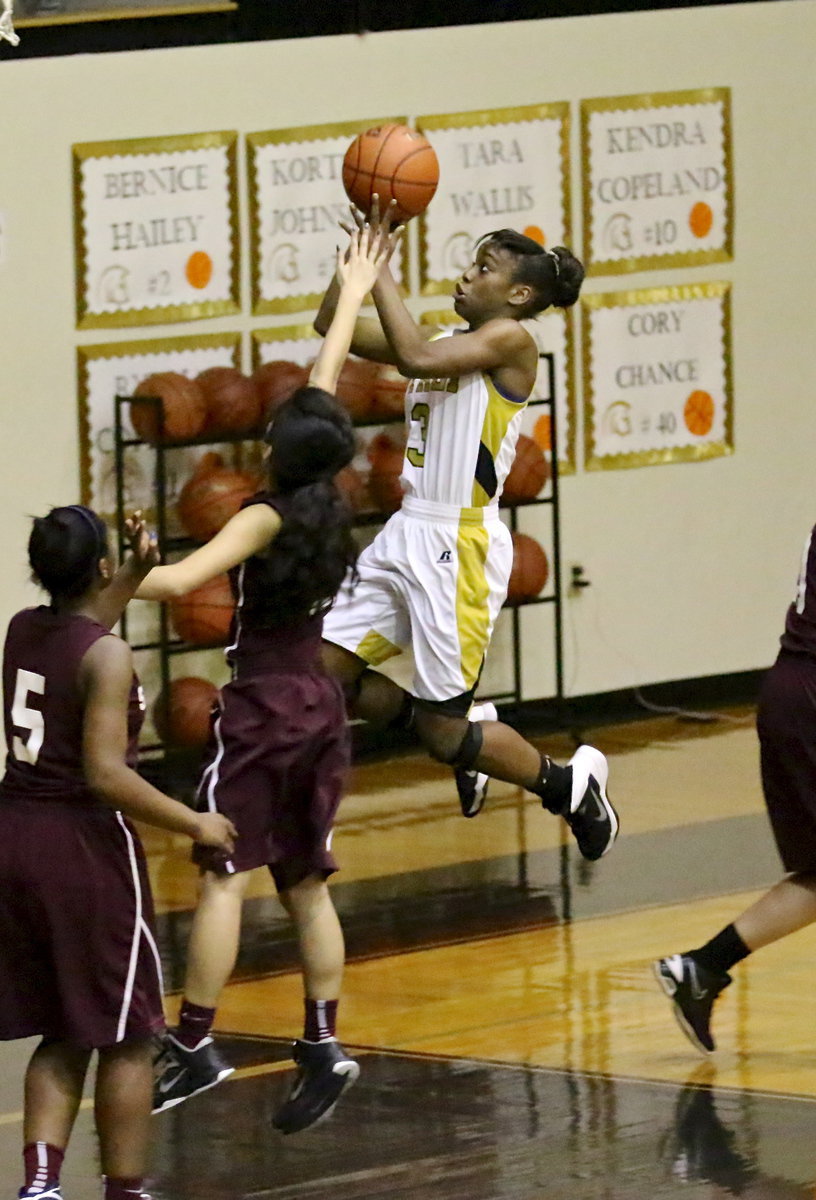 Image: The unstoppable one, Kortnei Johnson(3), attacks the basket to finish with 23-points.