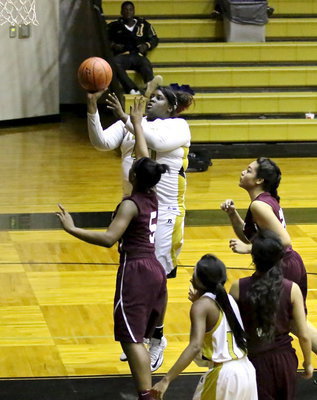 Image: Cory Chance(40) scores 2 of her 18-points against Summit.
