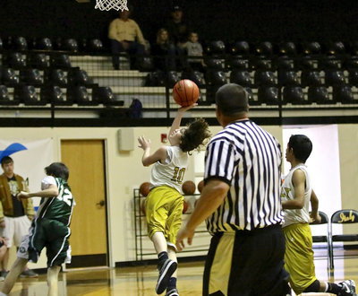 Image: Ryder Itson(10) twists his way to a 2-point finish off the fast break.
