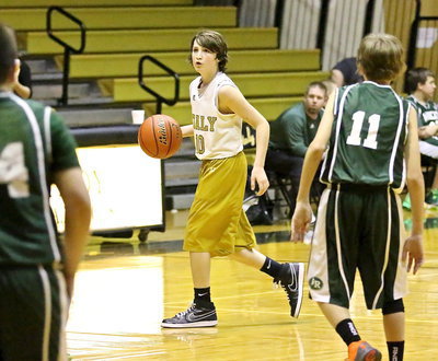 Image: Guard, Ryder Itson(10) checks the station while commanding the 7th grade offense.