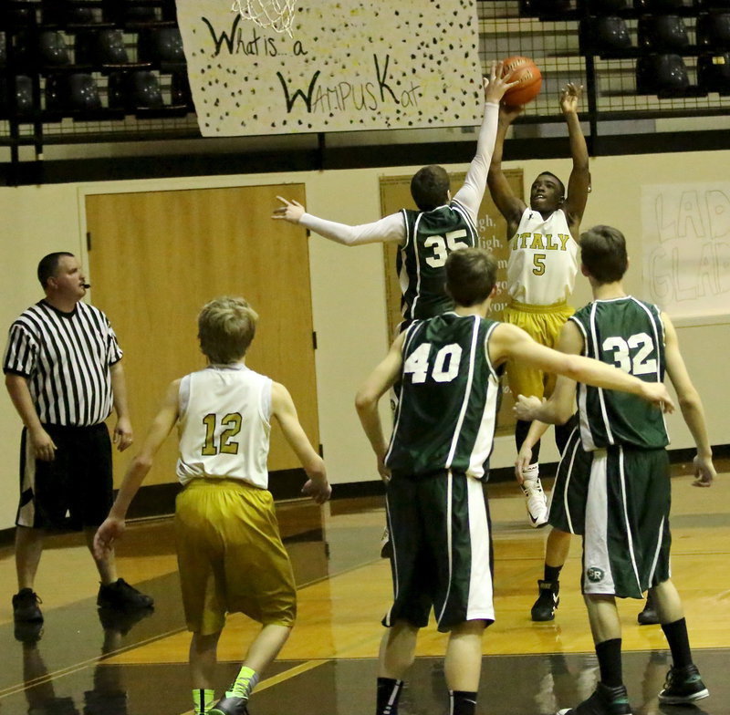 Image: Italy 8th grader, Kendrick Norwood(5) pulls up to take a mid-range jump shot.