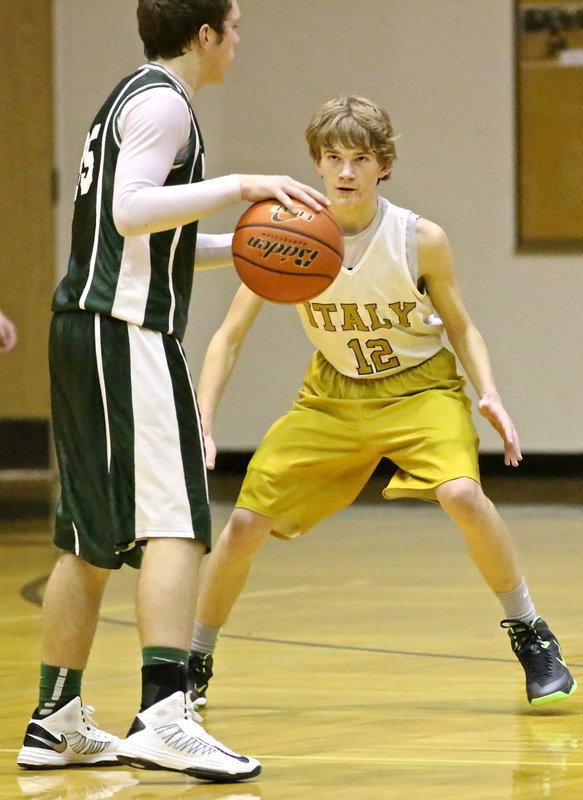 Image: Italy 8th grader, Garrett Janek(12) stalks a Scurry Wildcat ball handler.