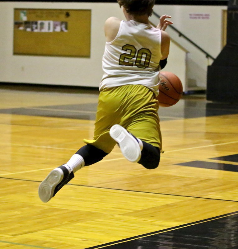 Image: Italy 8th grader, Cade Roberts(20) attempts to keep a ball in bounds.