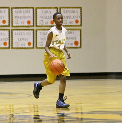 Image: Jaylon Lusk(1) dribbles the ball up court while trying to spot a weakness in the Rice defense.