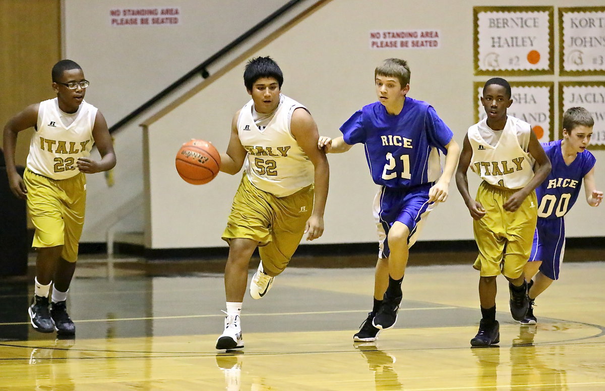 Image: Chris Davila(32) pushes the ball after securing a rebound.