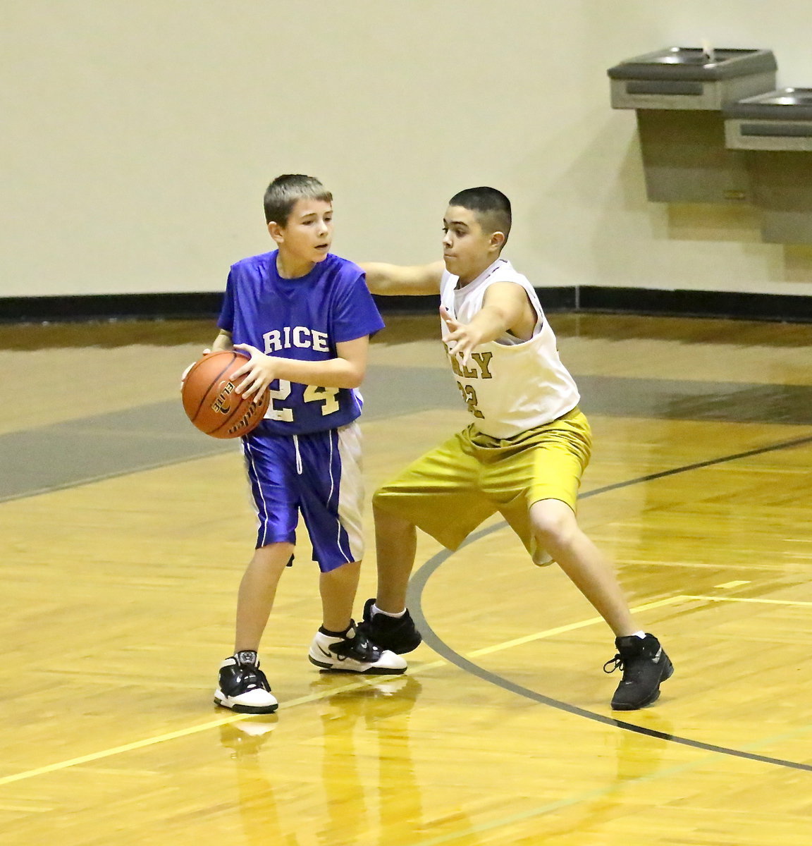 Image: Isaac Garcia(32) plays tight defense against Rice.