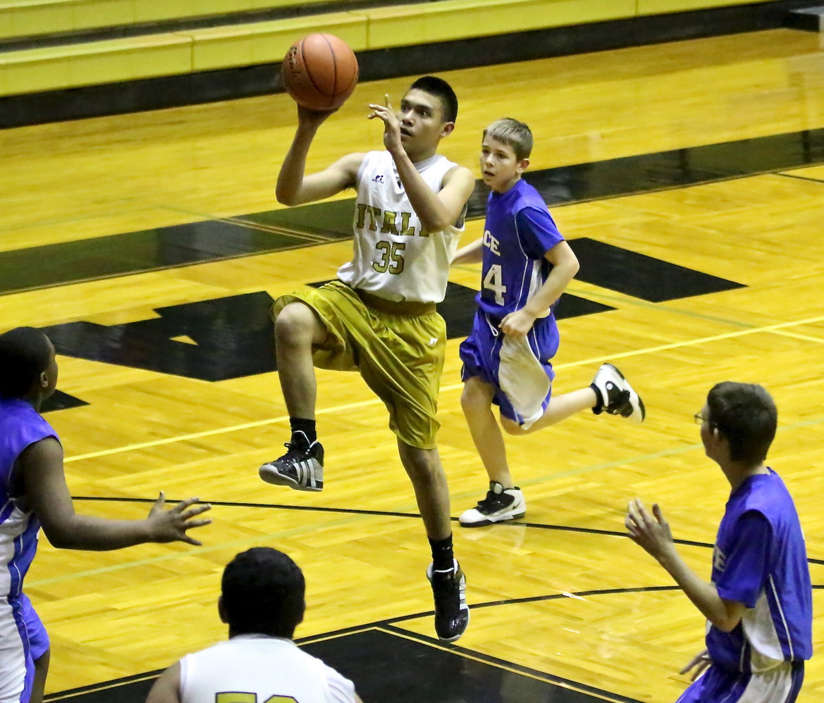 Image: Jonathan Salas(35) launches toward the basket.