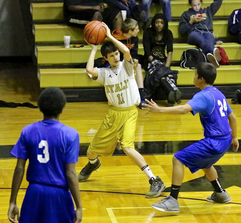 Image: Italy 8th grader, Ty Hamilton(11) passes to a teammate.