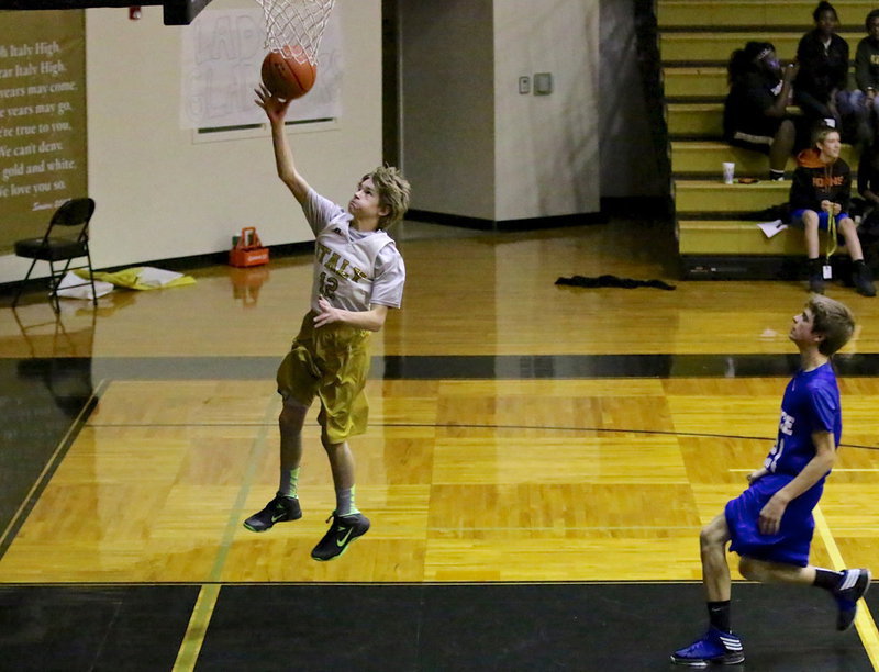 Image: Garrett Janek(12) confidently scores 2-points off the fast break.