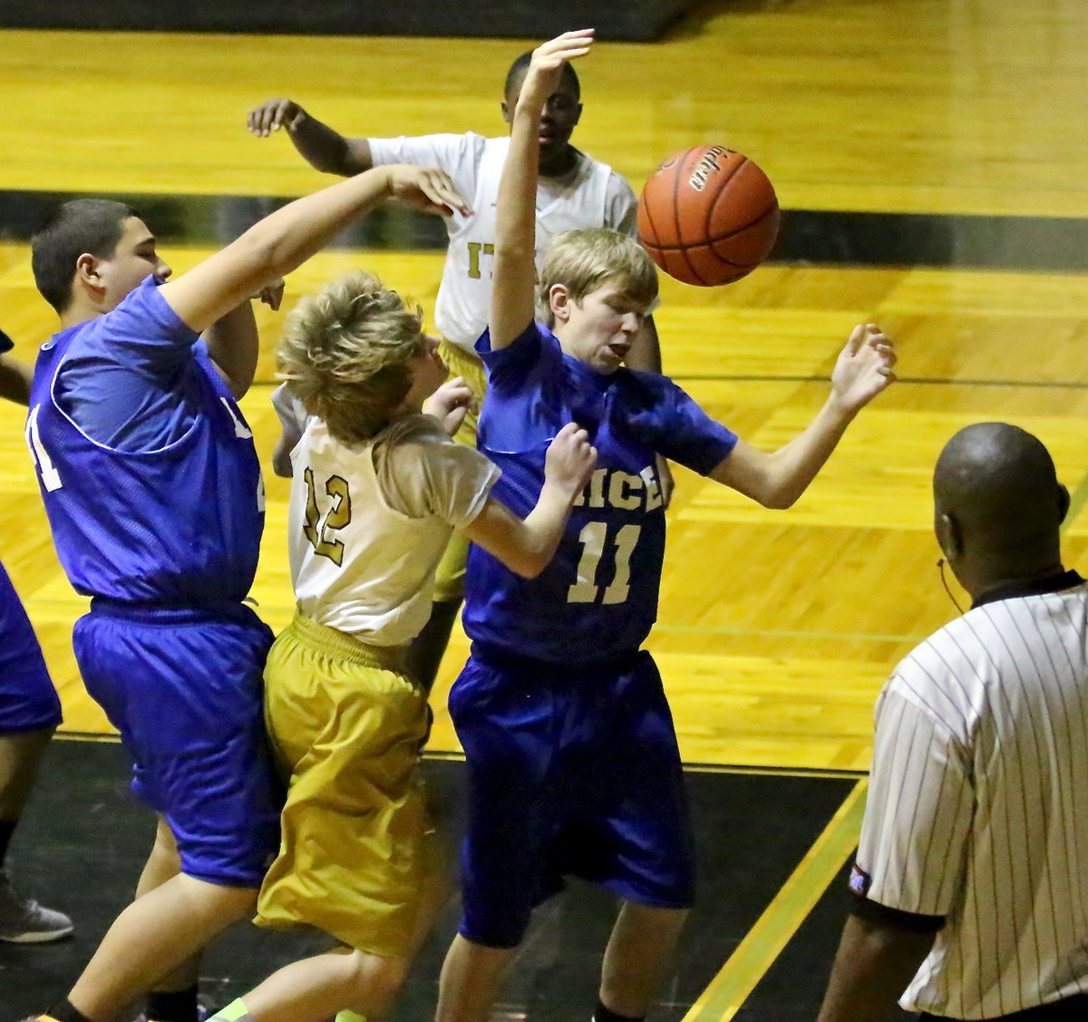 Image: Garrett Janek(12) endures a hard foul to earn a trip to the free-throw line.