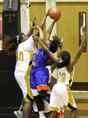 Image: Cory Chance(40) stuffs a Gateway shooter to help Italy’s defense swamp the Lady Gators.