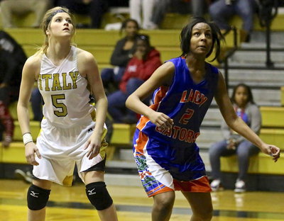 Image: Warrior like, Halee Turner(5) prepares to battle for a missed free-throw.