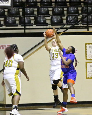 Image: Jaclynn Lewis(13) wins the battle for a defensive rebound.