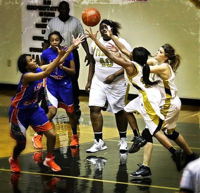 Image: Who wants it more? The Lady Gladiators proved they were hungrier for a win by out hustling the visiting Lady Gators as, Kendra Copeland(10) and, Halee Turner(5) make a play for the ball.