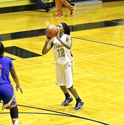Image: K’Breona Davis(12), takes a shot from 3-point land.