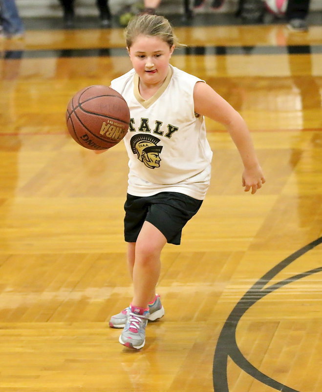 Image: Two-guard, Haley Mathers(5) dribbles around Hillsboro’s defense to help her IYAA 3rd/4th grade girls squad generate some offense.