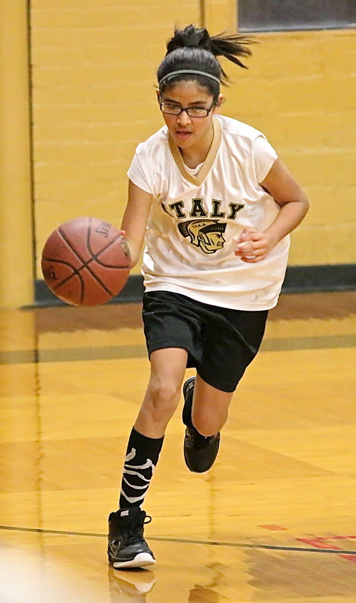 Image: Andrea Galvan(4) pushes the ball up the court for Italy.