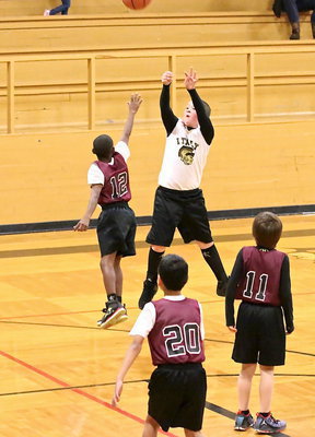 Image: Jayden Saxon(13) drops in one of his two 3-pointers. Saxon finished with 11-points.