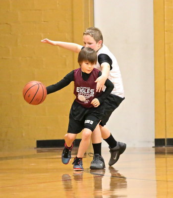 Image: Bryant Haake(3) plays tight defense on an Eagle ball handler in overtime.