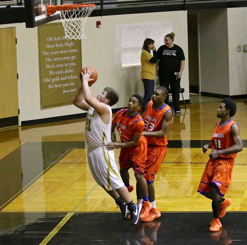 Image: Zain Byers(21) gets bumped from behind to foil a fast break try. Byers did manage to split the free-throws.