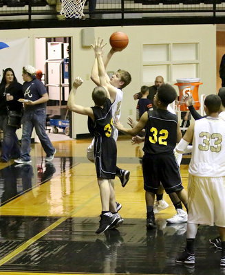 Image: JV Gladiator, James Walton(13) scores for Italy after getting his own rebound during their win against Itasca.