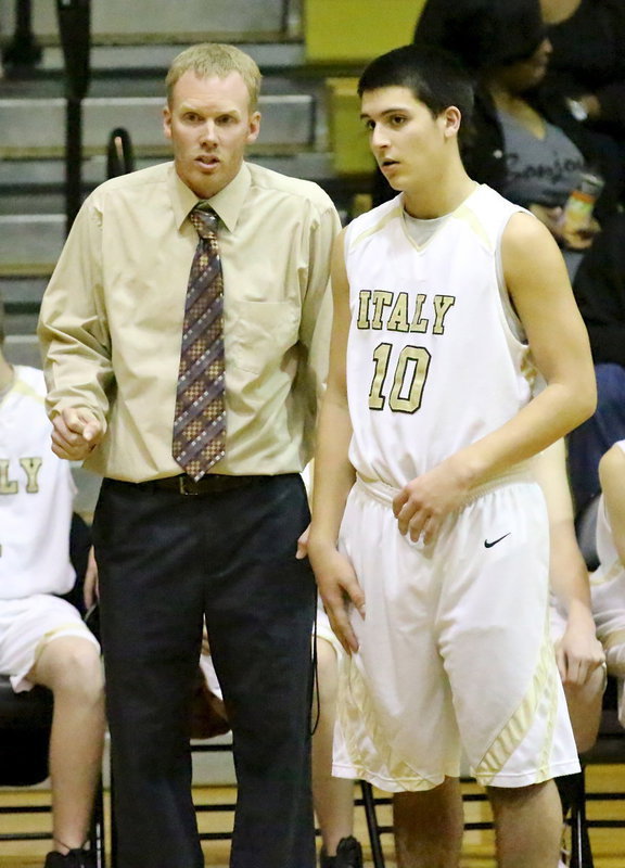 Image: JV head coach, Jon Cady talks strategy with Mason Womack(10).