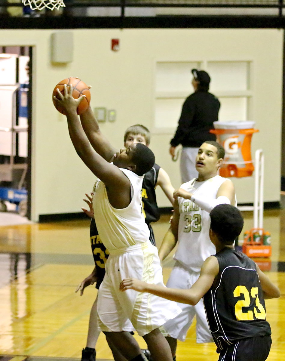 Image: Kenneth Norwood, Jr.(5) secures a rebound for the JV Gladiators.