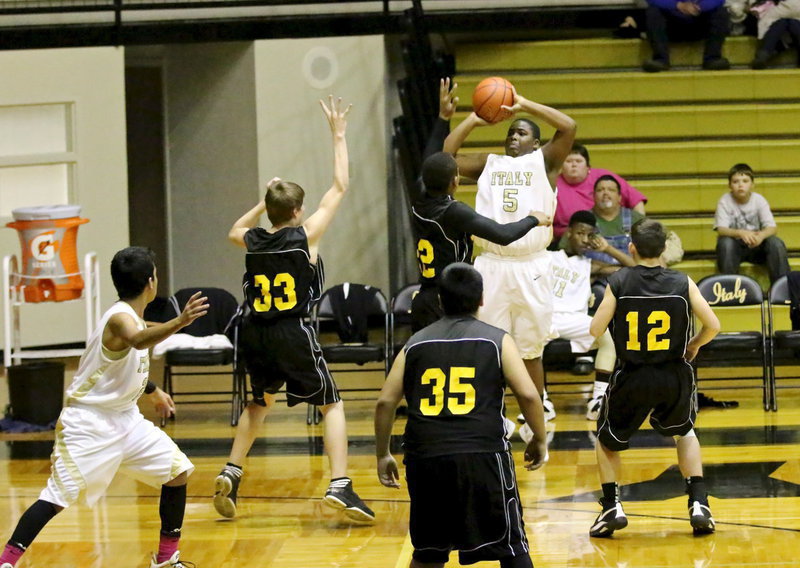 Image: Kenneth Norwood, Jr.(5) rises to shoot a jumper from beyond the 3-point arc.