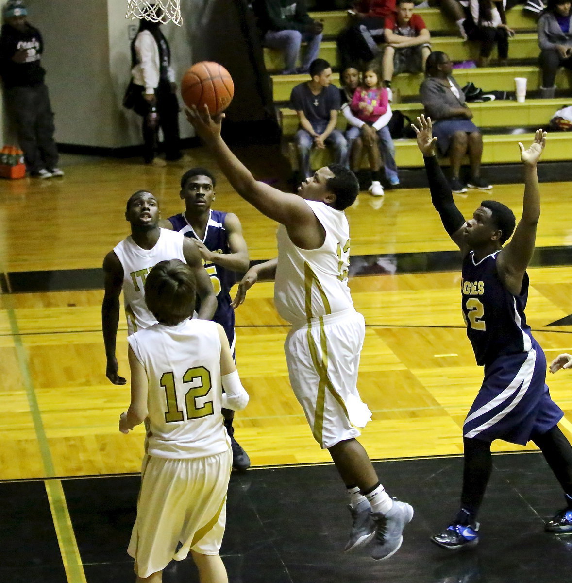 Image: Senior Gladiator, Darol Mayberry(13) powers into the paint to lay in two of his 7-points. Darol also dropped in a 3-pointer to help his teammates get a dominating 82-45 Senior Night win over Grand Prairie Advantage.