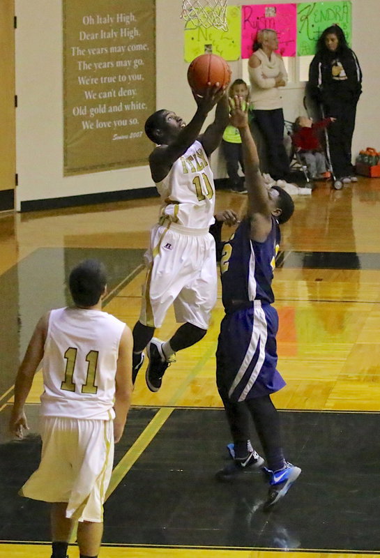 Image: Senior Gladiator, TaMarcus Sheppard(10) attempts to reverse in a basket. Sheppard finished his Senior Night experience with 17-points.