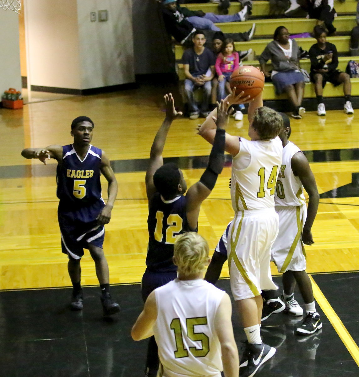 Image: Senior Gladiator, Bailey Walton(14) rises up for two of his 14-points during a memorable Senior Night performance against visiting Grand Prairie Advantage.