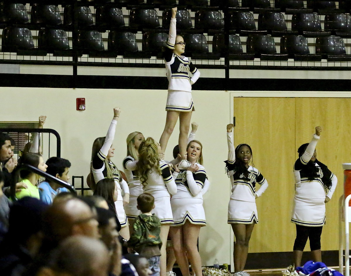 Image: Italy cheerleader, Karley Nelson tops off the stunt as, sister, Kirby Neslon and cheer mates, Hannah Haight, Annie Perry, Madison Galvan, Sydney Weeks, K. Jackson and Jada Jackson, help fill the Coliseum with some noise!!!!