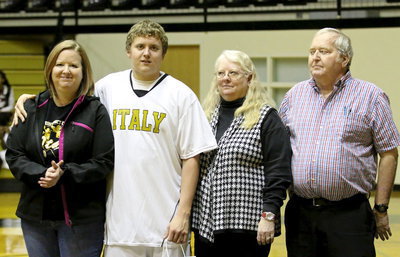 Image: Gladiator senior, Bailey Walton(14) is escorted by his mother, Michele Richards, and grandparents, Elaine and Greg Richards.