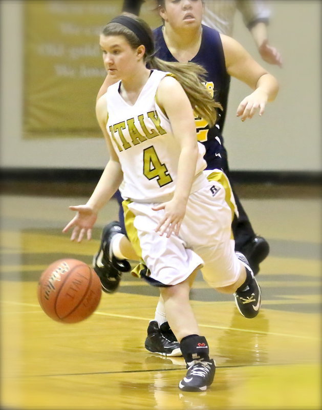 Image: Tara Wallis(4) uses the dribble to slice thru the Grand Prairie Defense.