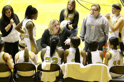 Image: Coaches, Melissa Fullmer and Tina Richards talk things over with their players during a timeout.