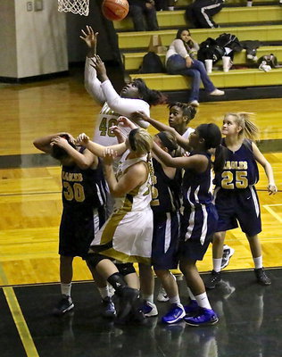 Image: Cory Chance(40) goes up for two of her 8-points over the Lady Eagles who wisely ducked.