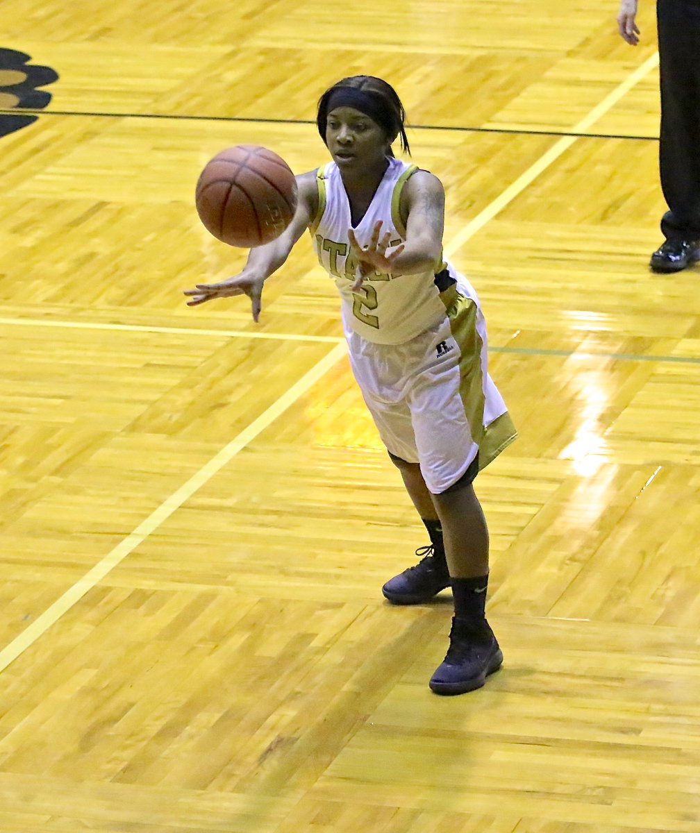 Image: Senior, Bernice Hailey(2) passes the ball to a teammate. Bernice, scored 6-points against Grand Prairie Advantage.